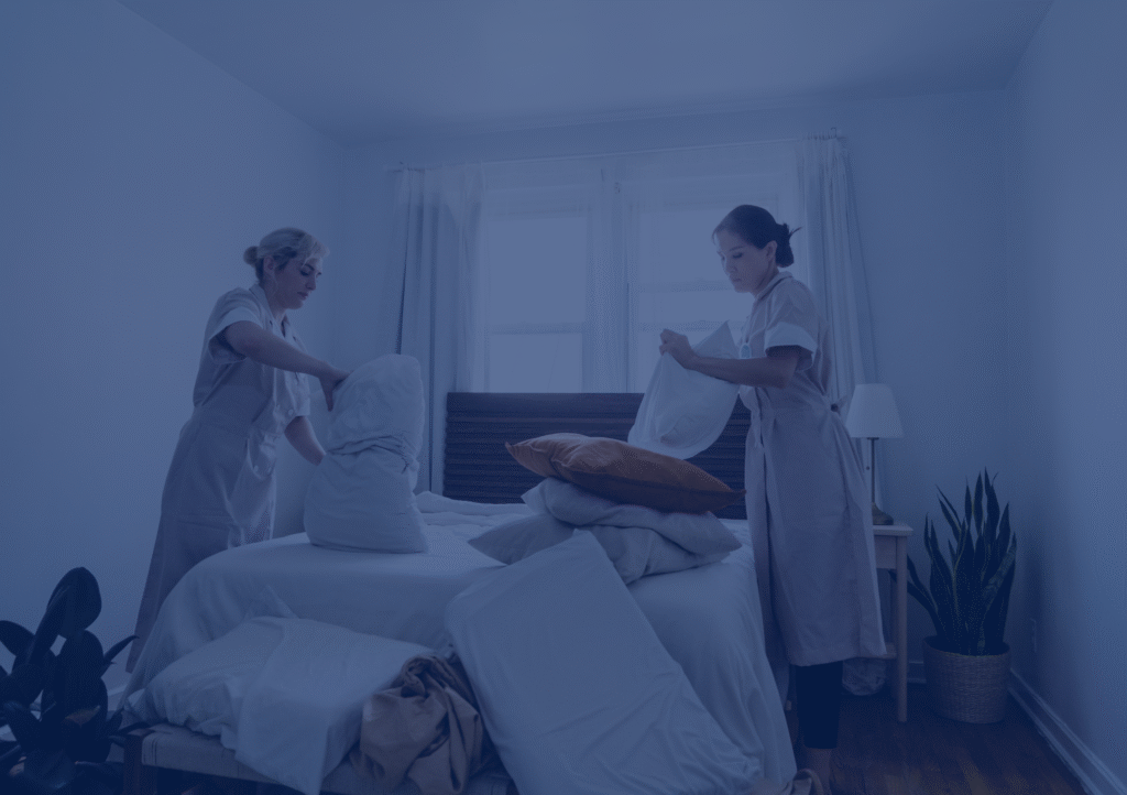 Professional cleaning team making a bed – residential cleaning service in Massachusetts